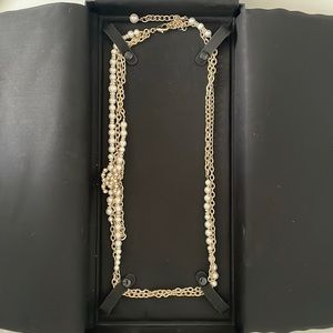 Chanel chain and pearls belt.